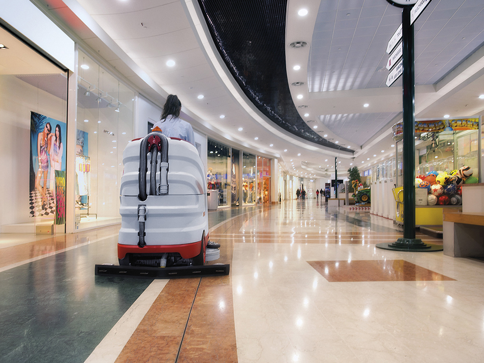 Comac Optima floor scrubber for the professional cleaning of a marble floor in a shopping center gallery